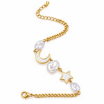 A gold chain anklet featuring three white baroque pearls styled as a crescent moon, a textured oval, and a star, displayed on a black background.
