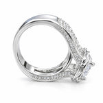 Silver ring with diamond accents on a textured gray surface
